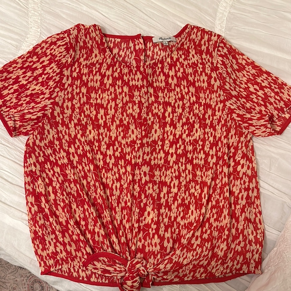 Red and cream women’s blouse